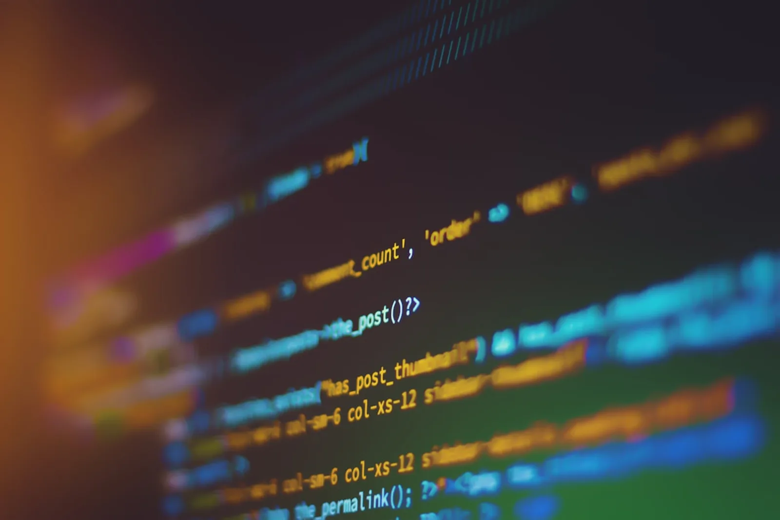 Hands typing on a keyboard with terminal code on screen